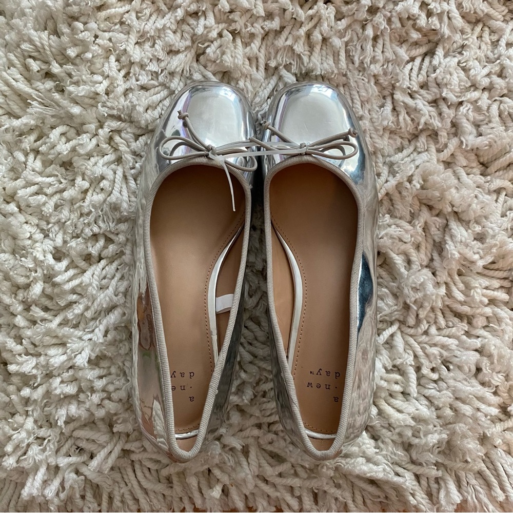 A New Day silver heels with a bow